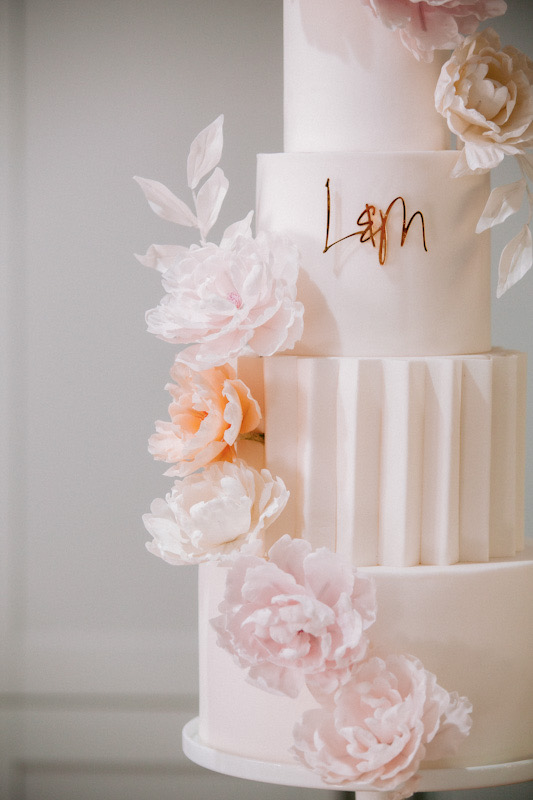 4 tier modern white wedding cake with origami panelling and blush sugar flowers | Louise Hayes Cake Design | Photo by Meghan Claire Photography