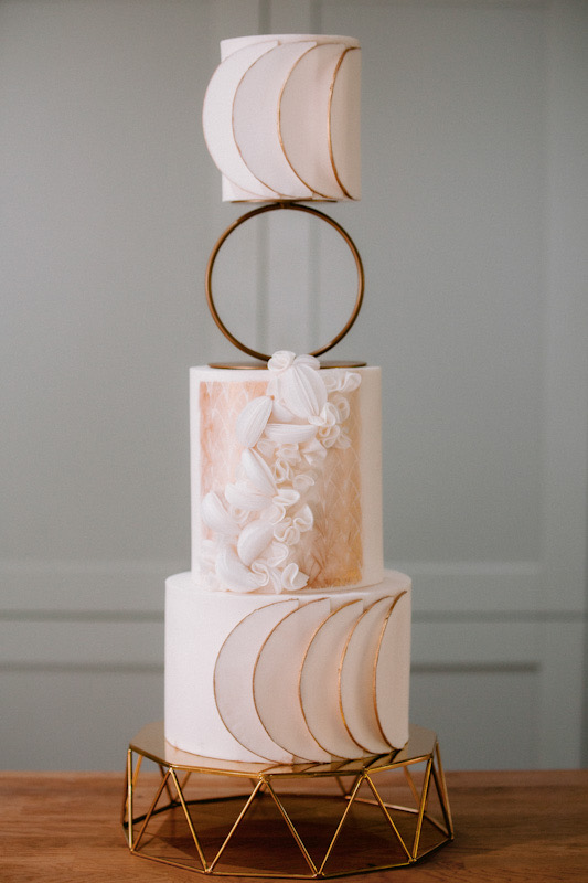 Modern white and gold wedding cake with wafer paper spheres and gold embossing | Louise Hayes Cake Design | Photo by Meghan Claire Photography