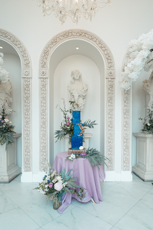 Contemporary square wedding cake in midnight blue, with gold crescent shape sugar blossoms | Foyle Park Country Estate | Louise Hayes Cake Design 