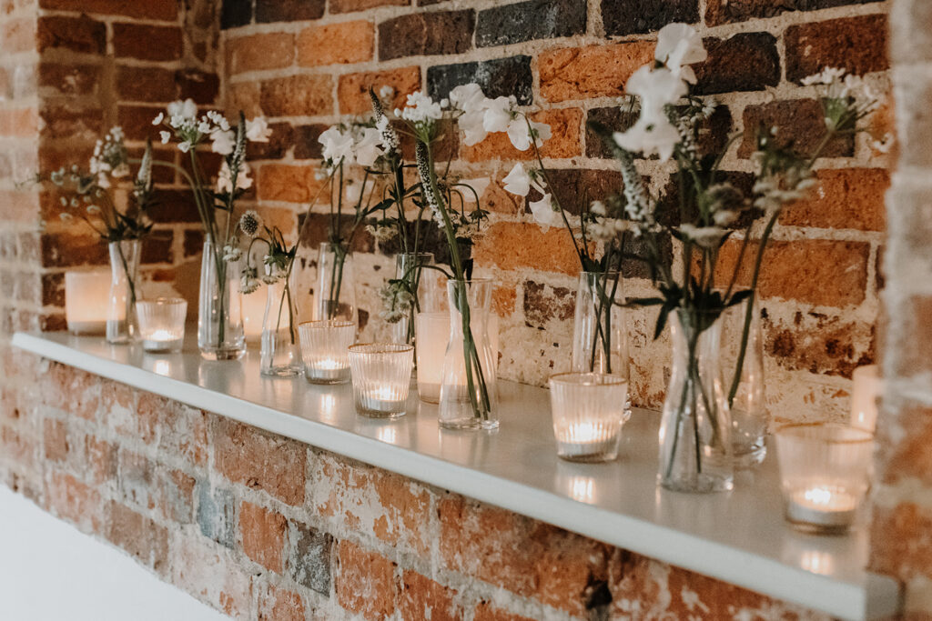 Small wedding day floral arrangements and candles | Louise Hayes Cake Design | Melissa Megan Photography | Cowdray Wedding