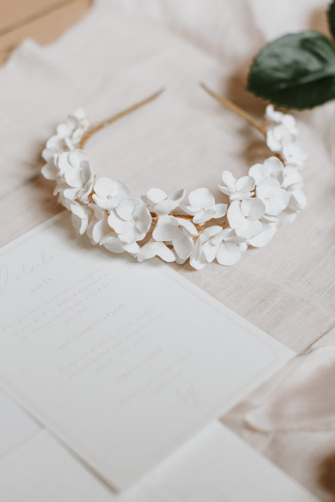 Gold bridal headpiece with white blossom flowers | Louise Hayes Cake Design | Melissa Megan Photography | Cowdray Wedding