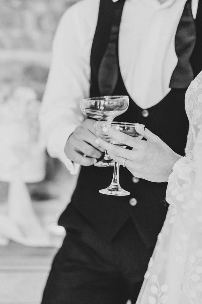 Close up of bride and groom with champagne | Louise Hayes Cake Design | Melissa Megan Photography | Cowdray Wedding