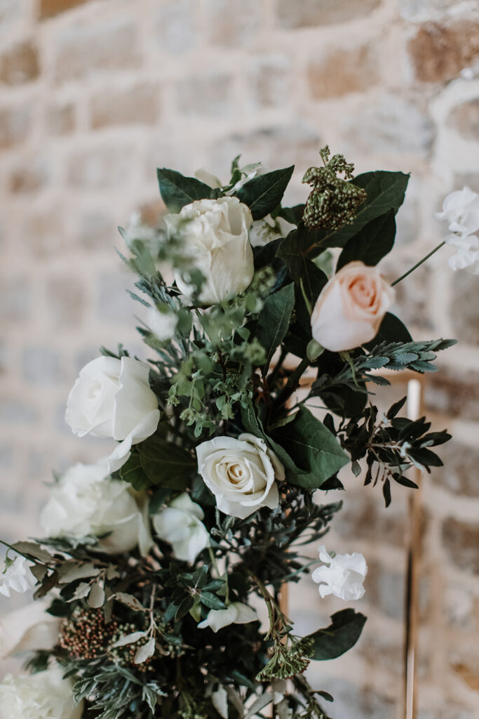 Close up of wedding flower arch | Louise Hayes Cake Design | Melissa Megan Photography | Cowdray Wedding